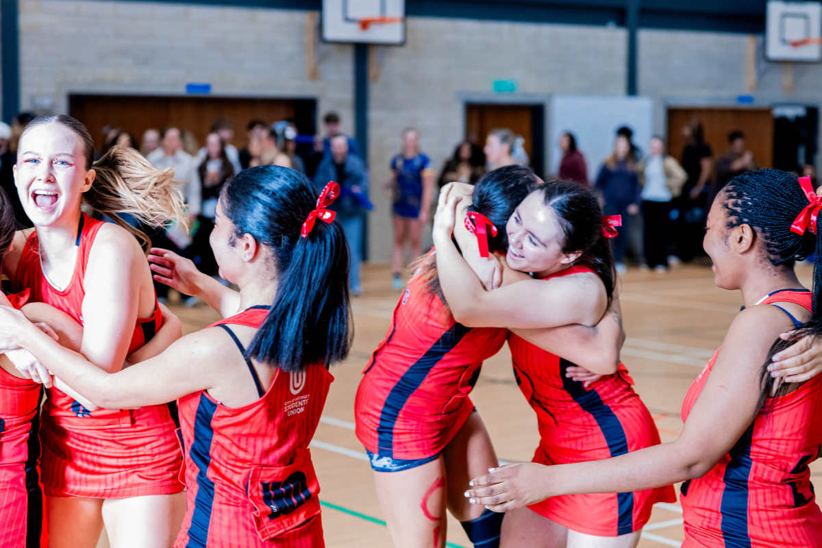 Group of female netballers celebrating