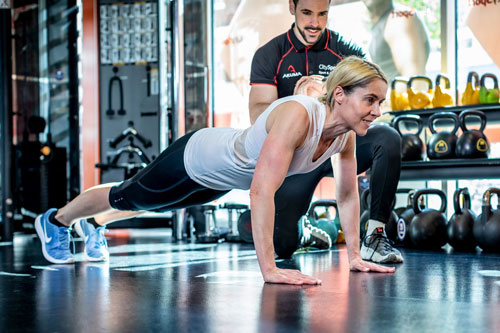 Gym user doing push ups