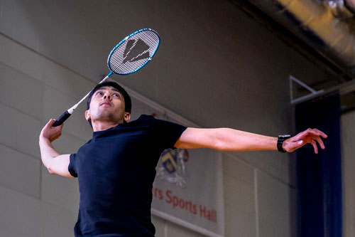 Image of student playing badminton